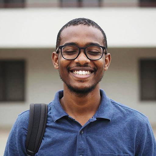 Smiling Dark-Skinned Man With Shoulder Bag