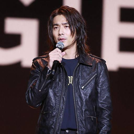 Young Man Singing on Dim Stage