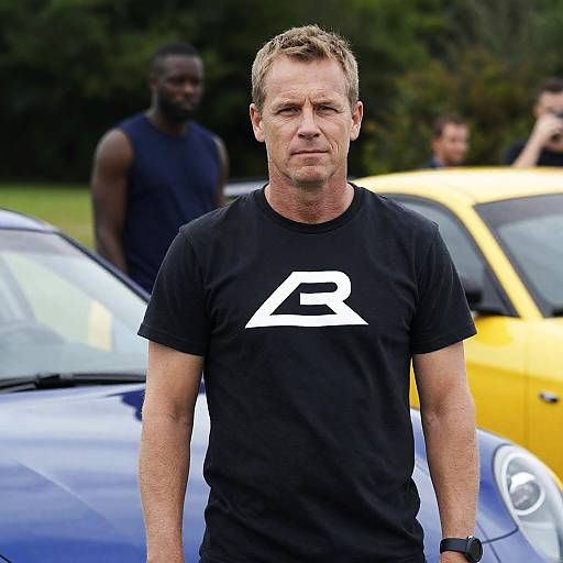 Stylish Man with Cars in Greenery