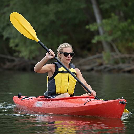 Woman Kayaking on Calm Waters