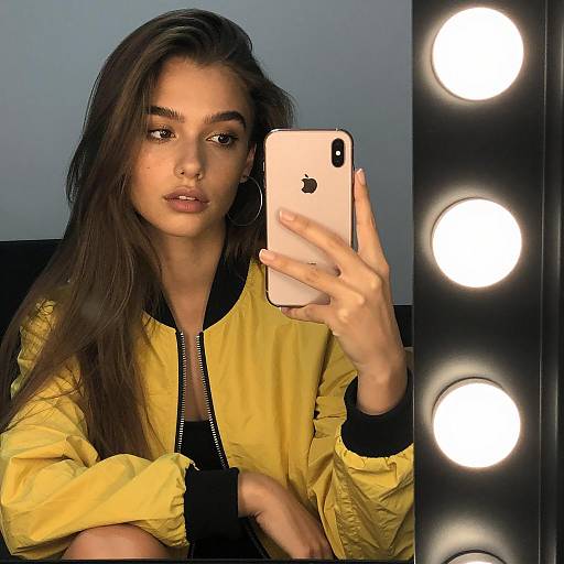 Selfie of Young Woman in Yellow Jacket