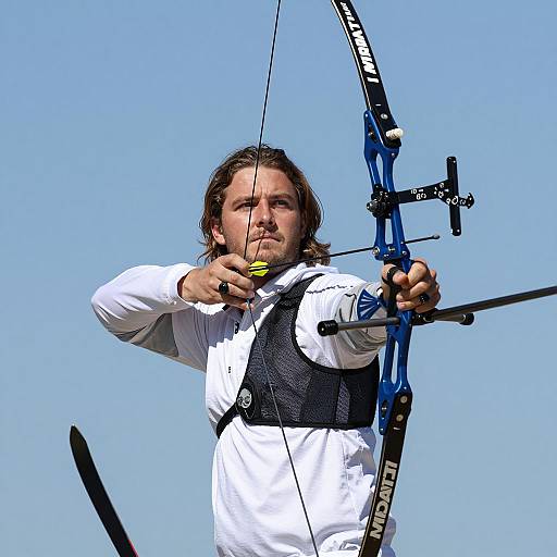 Dynamic Archer in Motion Against Blue Sky
