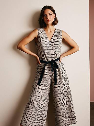 Elegant Woman in Geometric Jumpsuit