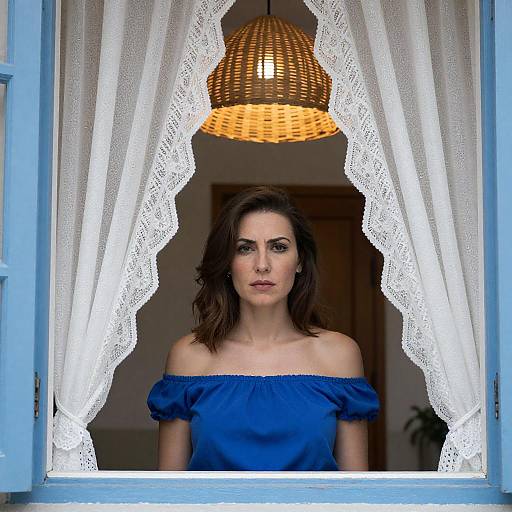 Serious Woman Behind Lace Curtain Window