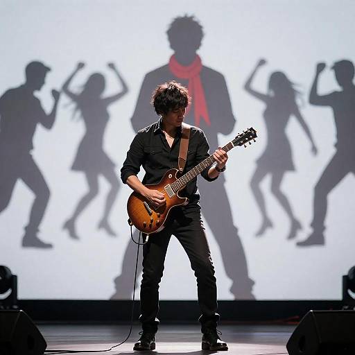 Electric Guitarist with Silhouetted Background