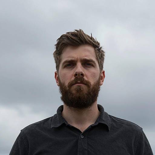 Serious Man Portrait Against Dramatic Sky