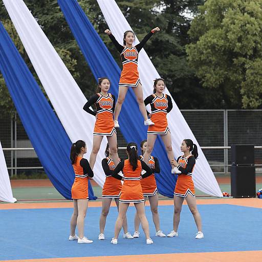 Outdoor Cheerleading Pyramid on Blue Stage