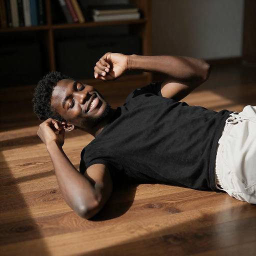 Sunlit Smile: Young Black Man Reclining