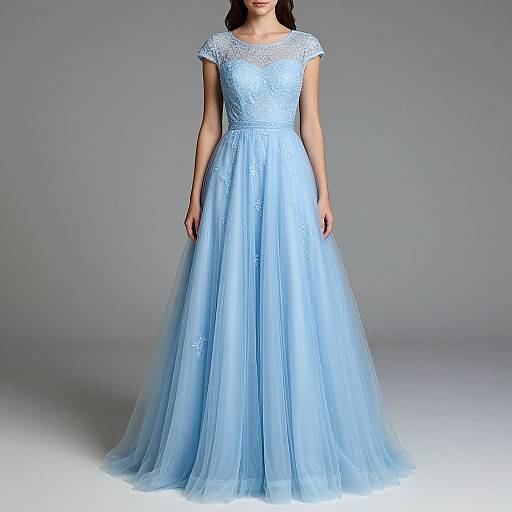 Photograph of a woman wearing a light blue, floor-length, lace-embellished, short-sleeved ball gown with a sheer bodice