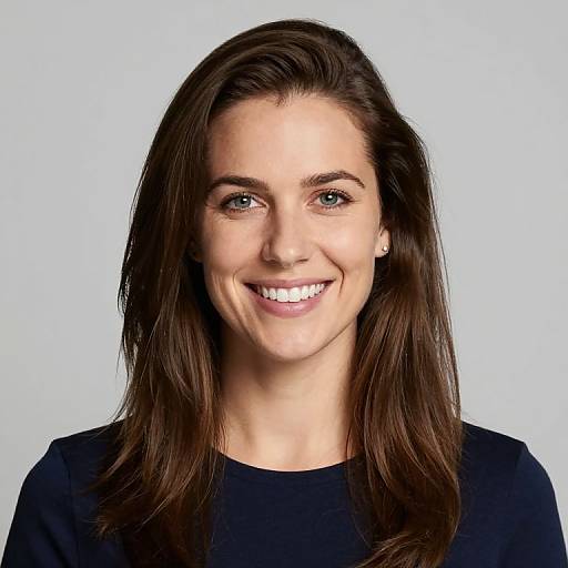 Photograph of a smiling young woman with fair skin, brown eyes, and straight brown hair, wearing a black top, against a plain white background.