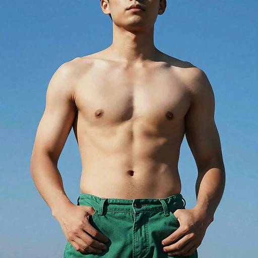 Muscular Man Under Vibrant Blue Sky