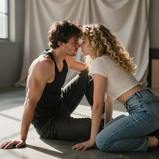 Intimate Moment Between Couple in Sunlit Warehouse
