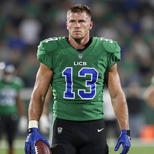 Serious American Football Player in Green Jersey