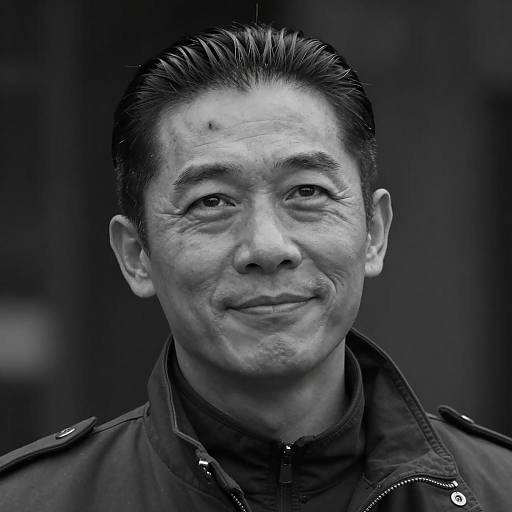 Slicked-Back Haired Man in Dark Photography