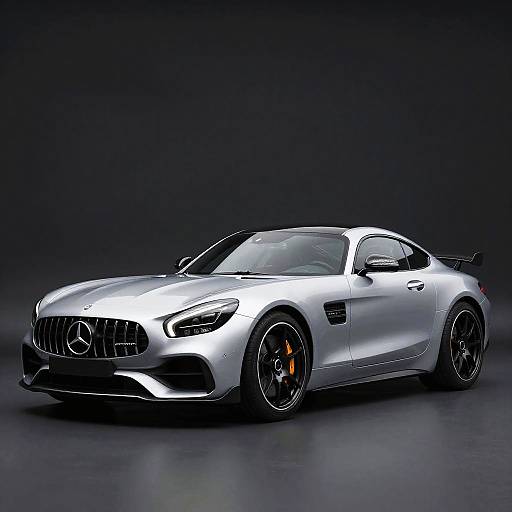 Photograph of a sleek, silver Mercedes-AMG GT coupe with black rims, orange brake calipers, and a sporty aerodynamic design against