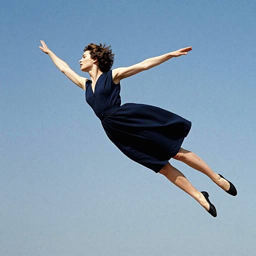 Woman Flying in Navy Dress Photo