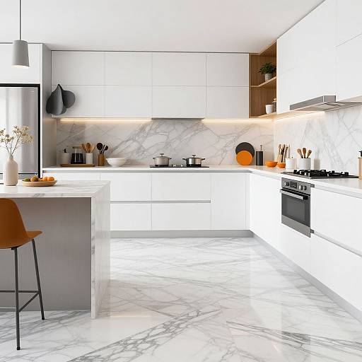 Modern, bright kitchen with white marble floors and cabinets, gray and black accents, orange stool, and minimalist utensils on countertops.