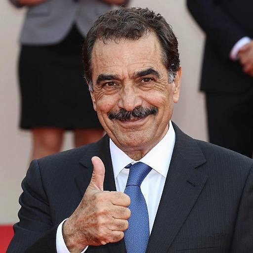 Smiling Man in Business Attire Thumbs-Up