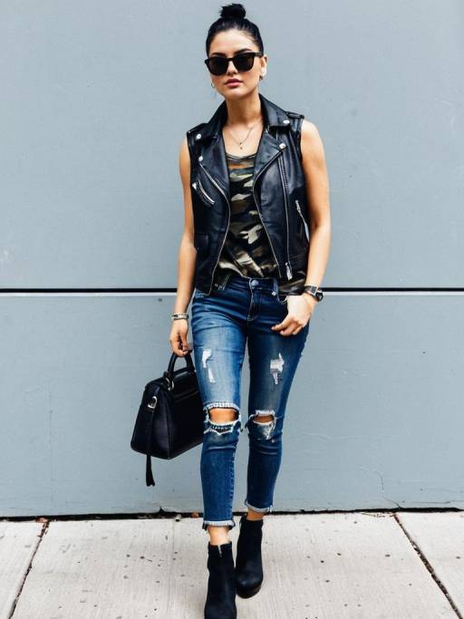 Edgy Woman in Leather Vest and Distressed Jeans