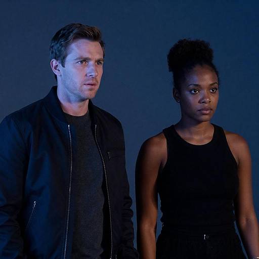 Two people in dim blue lighting