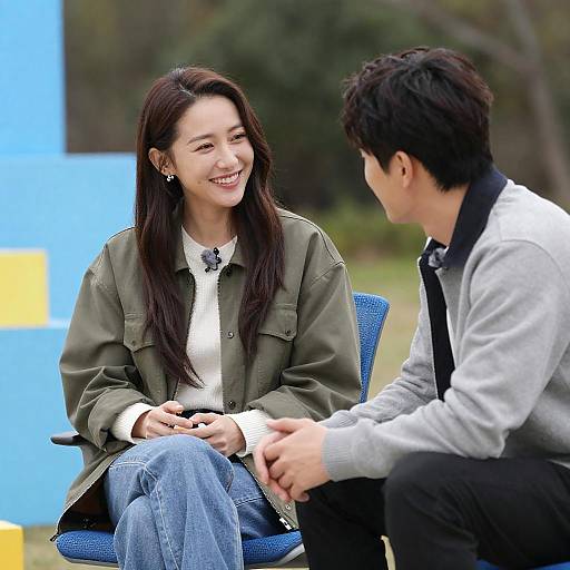 Smiling Couple Outdoors with Plush Toy