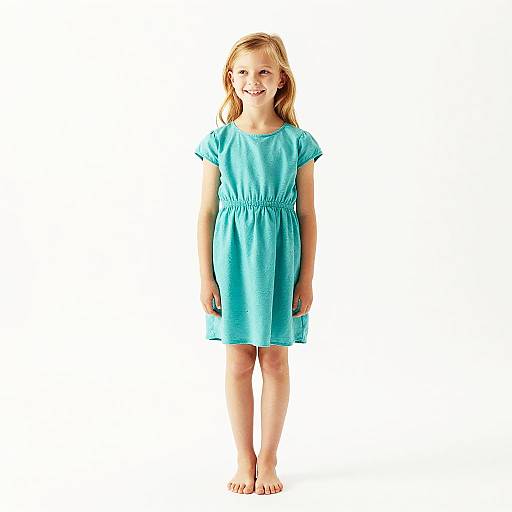 Smiling Blonde Girl in Teal Dress