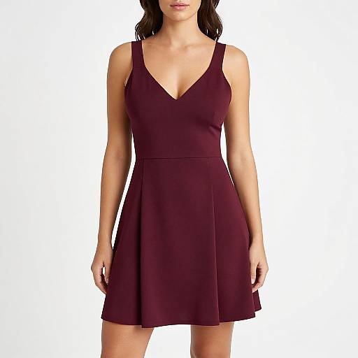 Photograph of a woman in a sleeveless, deep burgundy V-neck dress with a flared skirt, standing against a plain white background.