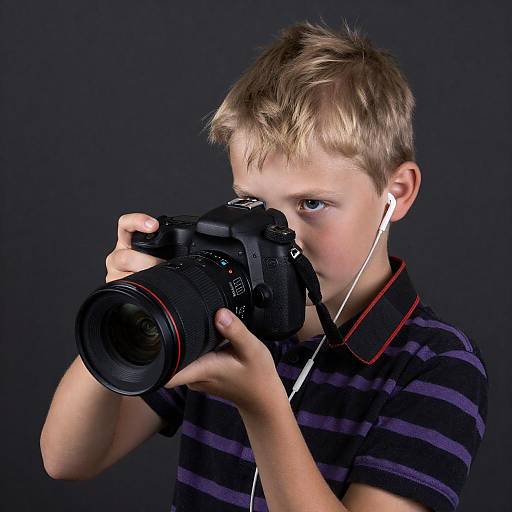Intense Focus: Blonde Boy with Camera