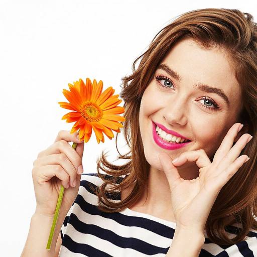 Playful Woman with Orange Daisy