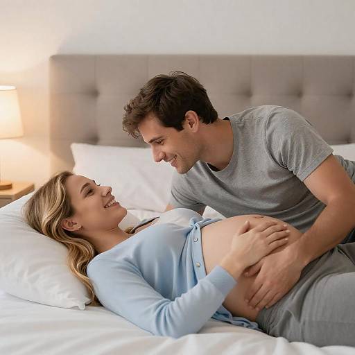 Joyful Expecting Couple in Bed