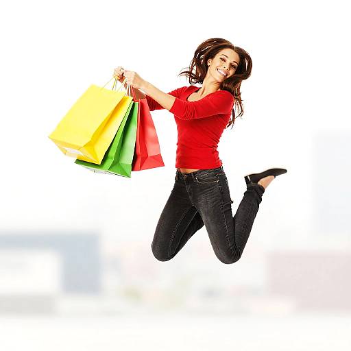 Joyful Shopper Jumping with Colorful Bags