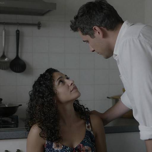 Intimate Moment in Dimly Lit Kitchen