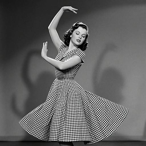 Black-and-white photograph of a 1950s-style woman with wavy hair, dancing in a checkered dress, arms gracefully raised, shadowed