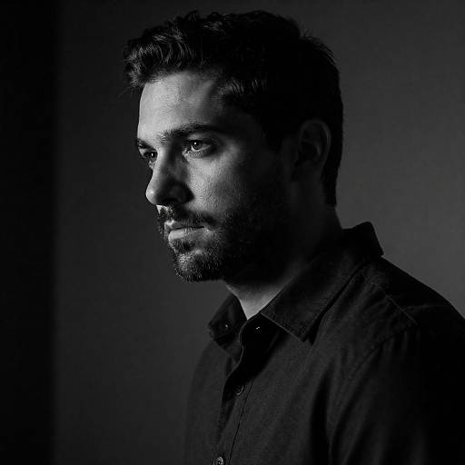 Moody High-Contrast Black-and-White Male Portrait