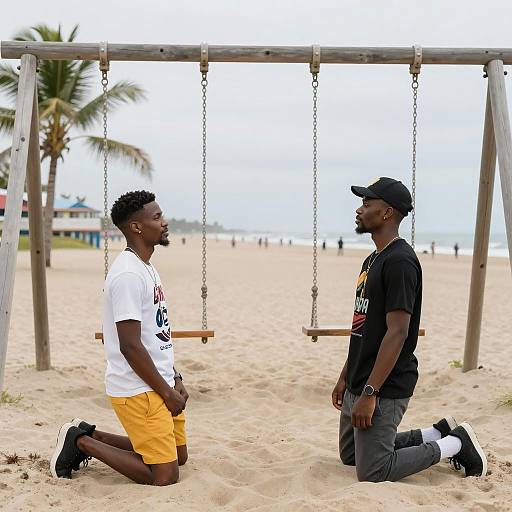 Two Men Kneeling on Beach Facing Each Other