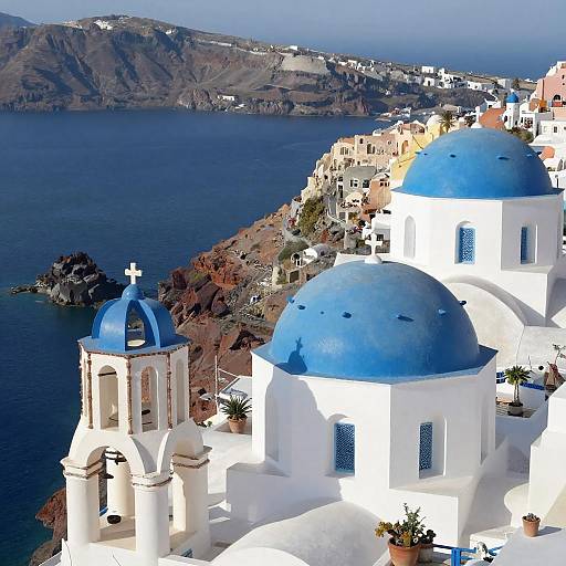 Blue Domed Churches on Santorini Cliffside