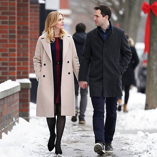 Couple Strolling on a Snowy Sidewalk