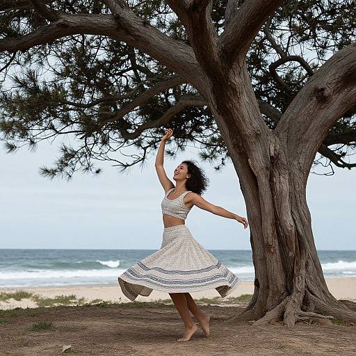 Photograph of a woman with dark curly hair, wearing a white lace dress, dancing under a large tree by the beach, with waves and sand in
