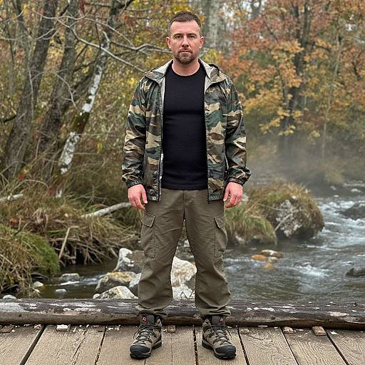 Man on Rustic Bridge in Autumn