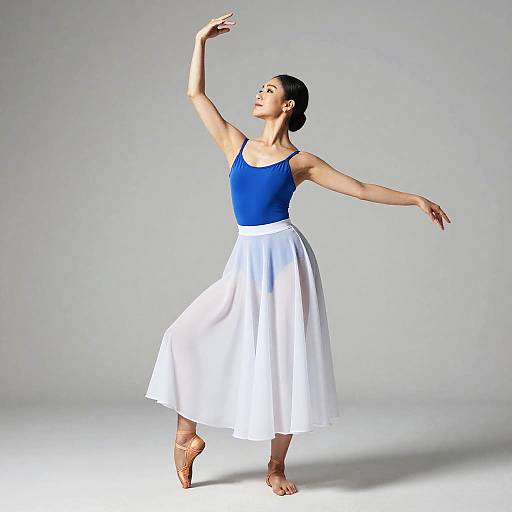 Ballet dancer in blue leotard and white skirt