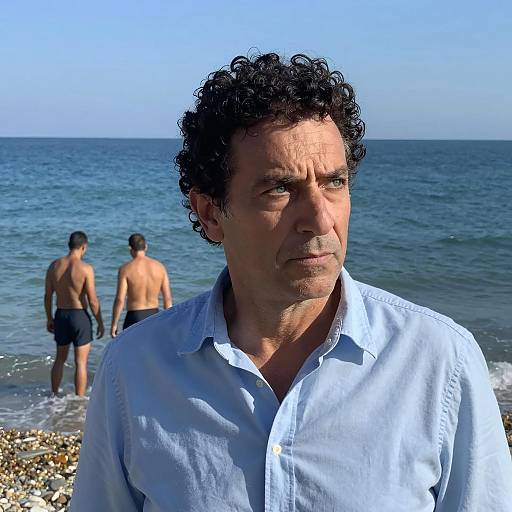 Middle-aged man on pebble beach near ocean