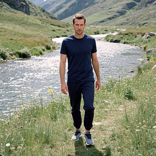 Man in Athletic Wear in Lush Valley