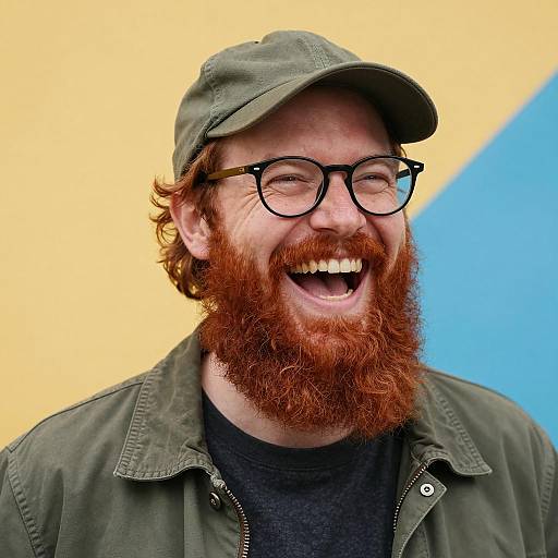 Cheerful Man with Red Beard and Glasses