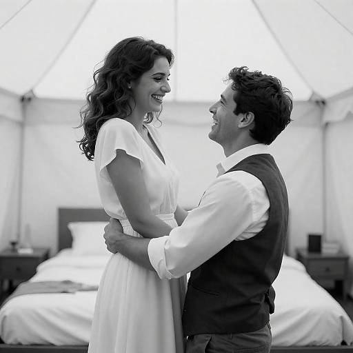 Black-and-White Smiling Couple in Tent