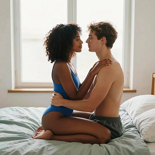 Couple Embracing on Bed in Romantic Scene