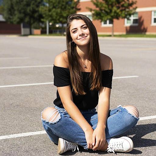 Casual Young Woman Sitting Outdoors