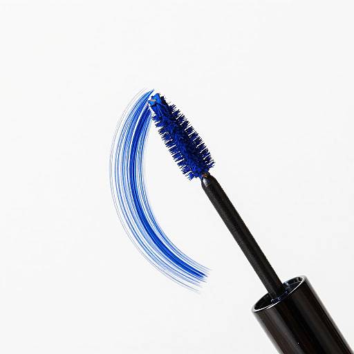 Photograph of a black mascara wand with blue bristles creating a curved, sweeping motion against a white background.