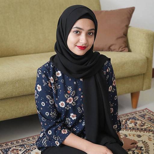 Young Woman in Hijab on Rug