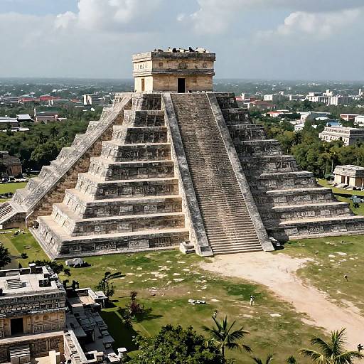 Photograph of El Castillo pyramid in Tulum, Mexico, featuring a large, stepped stone structure with a temple at the top, surrounded by lush green