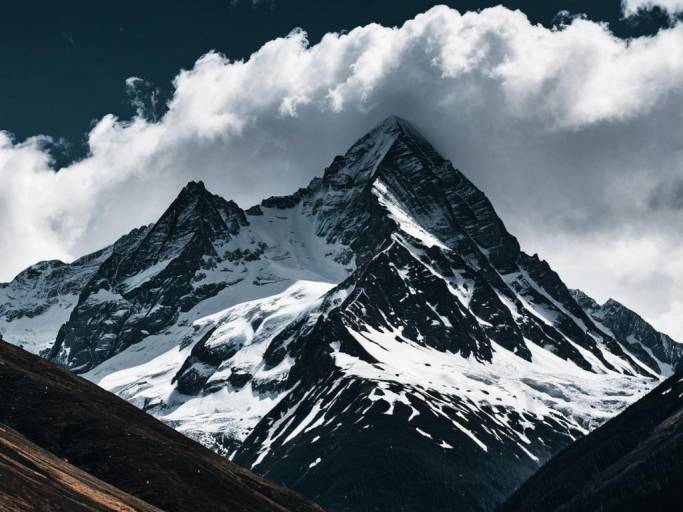 Dramatic Snowy Mountain Background Wallpaper